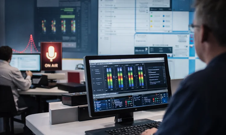 Pro AVL Control room operator interface audio control room with technician monitoring system levels and audio performance
