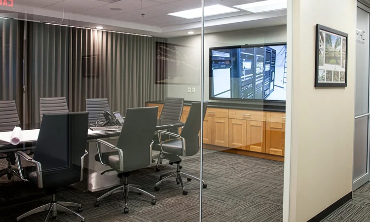 Enterprise Video Systems corporate conference room with multiple video displays and audio systems