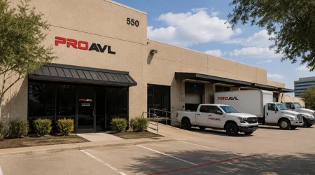 Pro AVL Dallas Office Exterior Pro AVL Dallas Office exterior with branded work vehicles outside a commercial facility