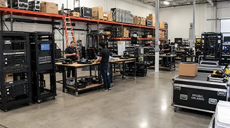 Pro AVL Orlando Corporate Office Warehouse Pro AVL Orlando Corporate Office warehouse with AV equipment racks and technicians preparing systems
